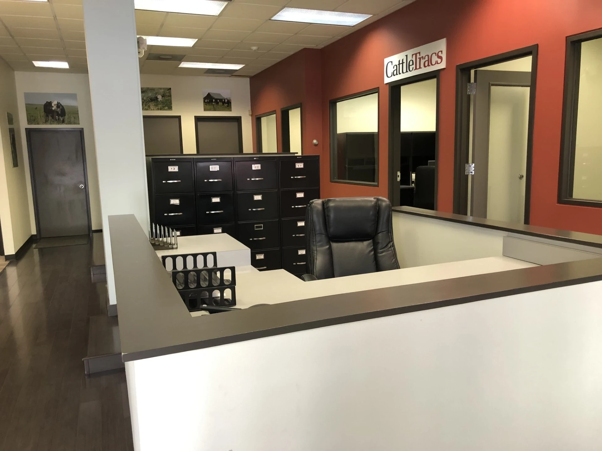 The CattleTracs office reception, with the CattleTracs sign on a red wall